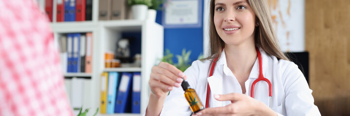 Doctor passes marijuana oil to woman patient