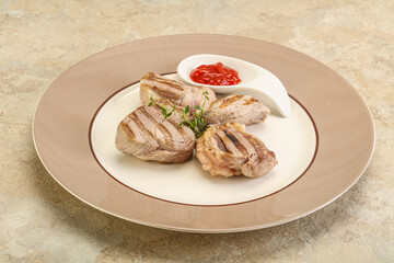 Grilled pork tenderlion with tomato sauce