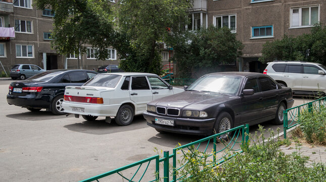 Kazakhstan, Ust-Kamenogorsk, june 25, 2021: Cars parked in the parking lot. City street. BMW E38 7-series