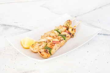 turkey skewer with pepper and  condiment