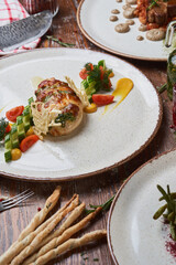 Italian meat, poultry and seafood dishes on a wooden table