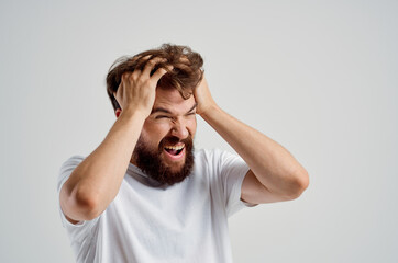 Fototapeta premium bearded man health problems migraine stress disorder light background