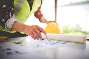 architect concept, working architect with blueprints in office to present to customers