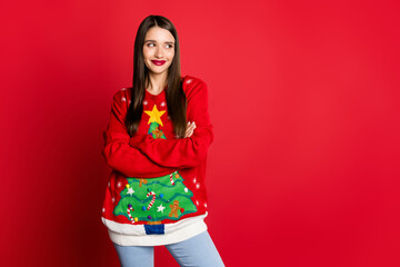 Photo of cunning girlish curious lady folded arms look empty space wear decorated sweater isolated...