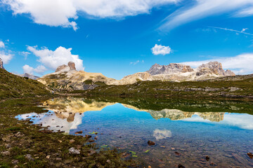 Panoramic view of the Sesto or Sexten Dolomites with reflection in the lake water, from Tre Cime di Lavaredo or Drei Zinnen, Dolomiti Di Sesto Natural Park, Bolzano, Trentino-Alto Adige, Italy, Europe