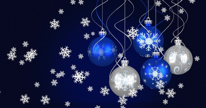 Animation of baubles and snow falling on dark blue background