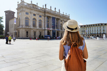 Cultural tourism in Europe. Back view of female tourist visiting Turin, Italy. - obrazy, fototapety, plakaty