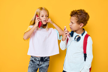 cute kids use gadgets with headphones