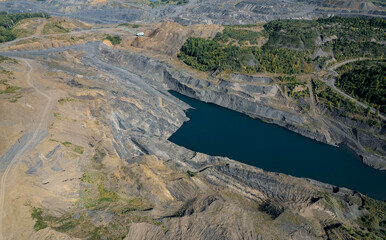Nature damage from mining gold, iron ore or coal Open mine.