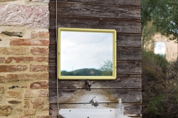 An external sink under a mirror in the garden of a farmhouse in the countryside (Umbria, Italy, Europe) - 458905928
