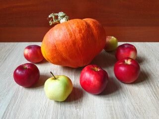 Natural vegetables ripe autumn harvest. Delicious ripe pumpkin and apples.