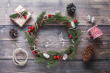 Beautiful Christmas wreath on wooden background, top view photography