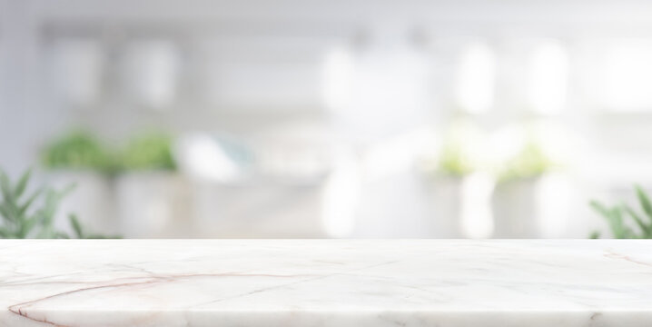 Marble stone countertop on blur kitchen interior background