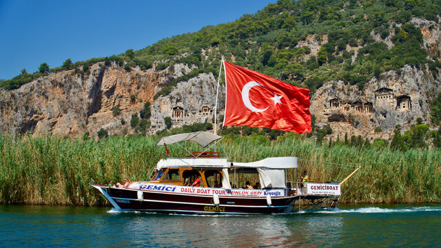 DALYAN, TURKEY - AUGUST 15, 2021: Dalyan Ortaca; Kaunos ancient city king rock tombs, Caretta Caretta spawning area Iztuzu beach. Calm nature, sea and historical tourism center.