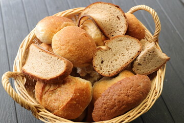 a basket with dry old rolls and bread 