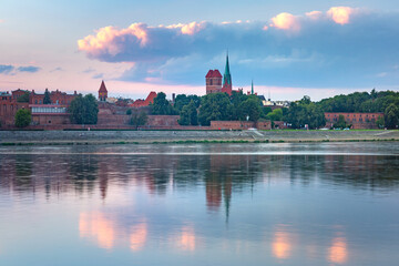 Fototapeta na wymiar Panorama of Old Town of Torun seen from the Vistula at sunset, Poland