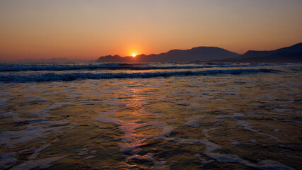 Spawning place of Caretta Caretta turtles: Iztuzu beach. Golden sun rays reflecting off the sea at sunset. Spectacular sunset at the meeting point of the Mediterranean and Aegean.