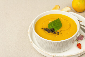 Pumpkin cream soup. Traditional autumn food. Hot dish, ripe vegetables, fragrant spices