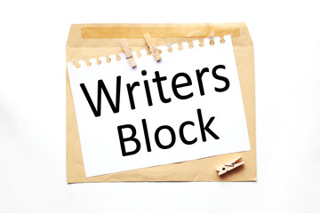 Writer Block. text on paper on craft envelope on white background