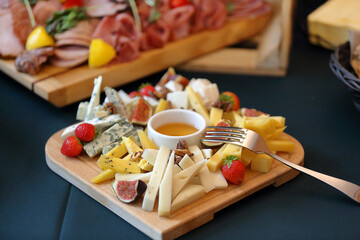 Fototapeta na wymiar Cheese board with different types of cheese