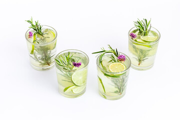 Cold fresh cocktail with summer herbs and lemon slices