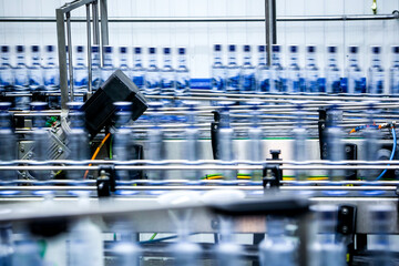 Conveyor line of bottles at factory of alcohol beverage