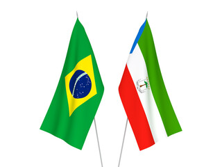 National fabric flags of Brazil and Republic of Equatorial Guinea isolated on white background. 3d rendering illustration.