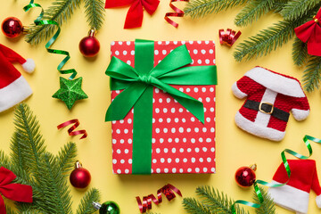 Christmas composition. Gifts box with new year decorations on colored background. Christmas, winter, new year concept. Flat lay, top view, copy space