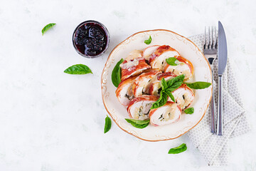 Baked chicken rolls with basil and cheese on  plate. Healthy lunch. Keto diet.Top view, above