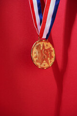 Close up gold medal on red background