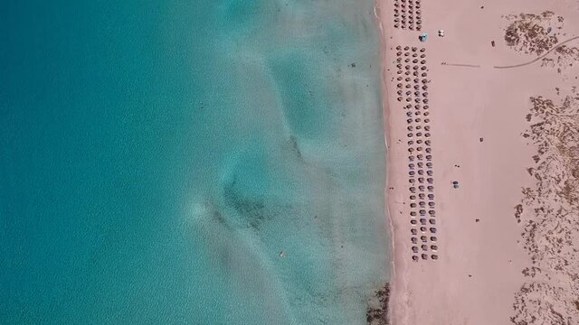 Aerial view of Simos beach in Elafonisos island in Greece. Elafonisos is a small Greek island the Peloponnese with idyllic exotic beaches and crystal clear waters. Laconia, Greece, Europe