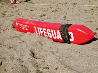 life saving sign on the sand