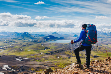 Obraz premium Active hiker enjoying the view on the trail in Landmannalaugar, Iceland. travel, sport, lifestyle concept