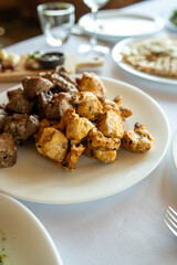 Grilled chicken on white plate 