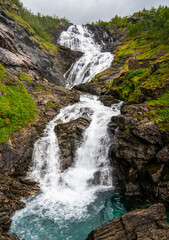 Fototapeta na wymiar Large waterfall on the route between Myrdal and Flam, Norway 