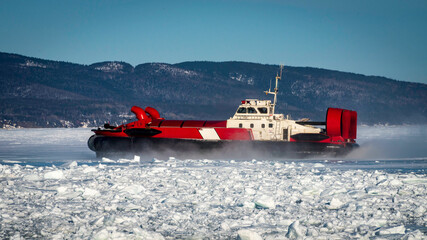 Coast Guard hovercraft breaking ice near a small community in  eastern Quebec, Canada.