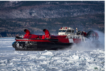 Coast Guard hovercraft breaking ice near a small community in  eastern Quebec, Canada.