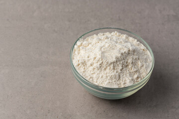 Flour in a glass bowl cooking preparation concept with copy space