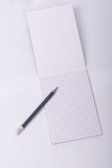 Pencil and open notebook