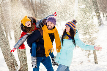 Photo of excited family mommy daddy daughter happy positive smile rejoice winter snowy weather walk...