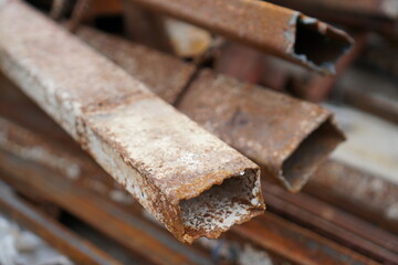 Stack of the old steel tube bars with the rusty, Components in a construction