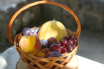 Vintage basket filled with various fruit. Selective focus.