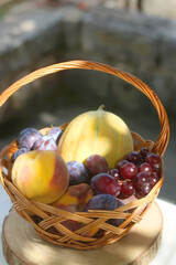Vintage basket filled with various fruit. Selective focus.