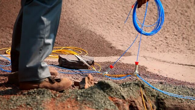 The process of placing explosives in an iron ore quarry. Explosives work in a quarry. Explosive work in the quarry