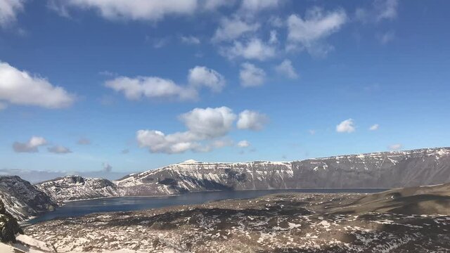 Time-lapse view of paradise on earth 'Nemrut Crater Lake'. Crater lake on top of snowy mountain. Nemrut Crater Lake is located in the Tatvan district of Bitlis province in eastern Turkey.