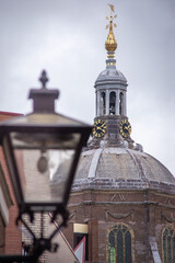 Obraz premium View of the dome of the Mare kerk, church in the center of the town and lamppost, Leiden, Netherlands