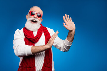 Fototapeta na wymiar Photo of funny cute mature man dressed white pullover red glasses dancing smiling isolated blue color background