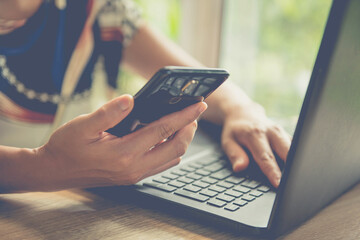 Businessman using mobile smartphone with data information banking network connection on screen, Business report  on computer screen network,working from home,socail distance concept.