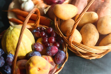 Various seasonal fruit and vegetable on dark background. Selective focus.