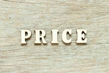 Alphabet letter in word price on wood background